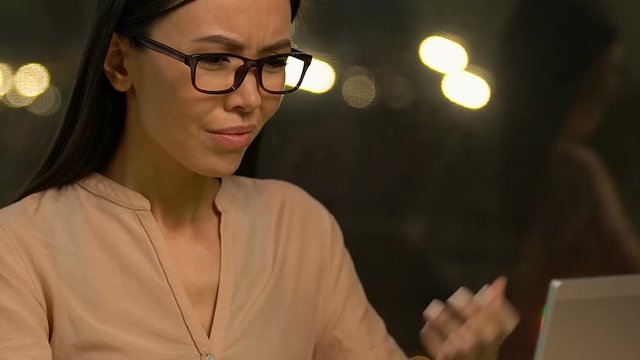 Anxious lady feeling confused with absurd task, computer virus destroying work