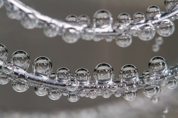 Air bubbles under the water on wire closeup