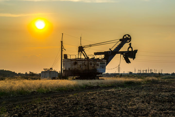 Fototapeta premium Biggest excavator in the world working, Bagger 228, Ukraine. Big mine, develop mineral resources, excavator digs, metallurgy in Ukraine