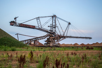 Fototapeta na wymiar Biggest excavator in the world working, Bagger 228, Ukraine. Big mine, develop mineral resources, excavator digs, metallurgy in Ukraine
