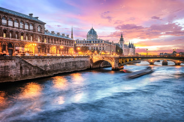 Obraz na płótnie Canvas Beautiful colors of Napoleon Bridge at dusk with Seine river - Paris, France.