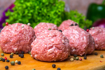 raw mince patties in a cooking . cutlets are prepared for cutting board