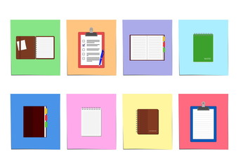 Set of notebooks and clipboards on colored sheet of paper