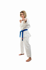 Female wearing martial arts uniform making karate move