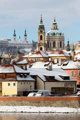 Snowy Prague Lesser Town with St. Nicholas' Cathedral, Czech republic