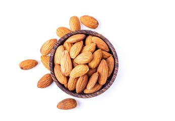Almond Nuts in wood bowl isolated on white background. top view