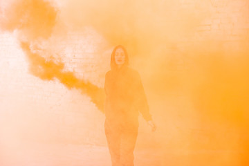 portrait of military girl outdoor of orange smoke