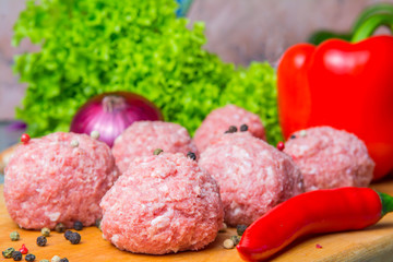 raw mince patties in a cooking . cutlets are prepared for cutting board