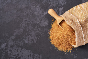 Sugar powder  in bag on black background.Flat lay