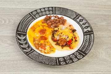 Chili Rellenos on Aztec Design Platter with Tostados and Barracho Beans