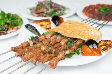 Traditional Turkish Adana Kebab or kebap meat food in Turkish Restaurant with salad