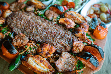 Traditional Turkish Adana Kebab or kebap meat food in Turkish Restaurant with salad