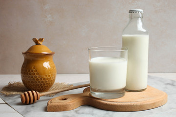 Jar of honey and glass of milk