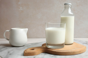 Milk in glass and glass bottle, milk jug