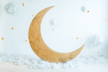Children's location for a photo shoot: the moon with stars and clouds. A place for dreams