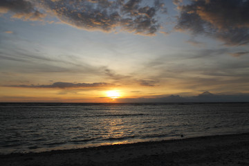 Naklejka na ściany i meble GILI TRAWANGAN, INDONESIA - December 02, 2013: Sunset at the Beach of Gili Trawangan. The biggest of the three popular Islands near Lombok, Indoniesia.