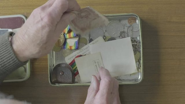 Senior Caucasian Man Looking Through A Memory Box Themes Of Memories Nostalgia Old