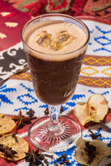 Irish Coffee cups with cream on a dark background, on the colorful background, warming cocktail