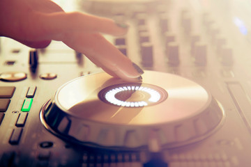 Obraz premium DJ Hand Mixing on Controller