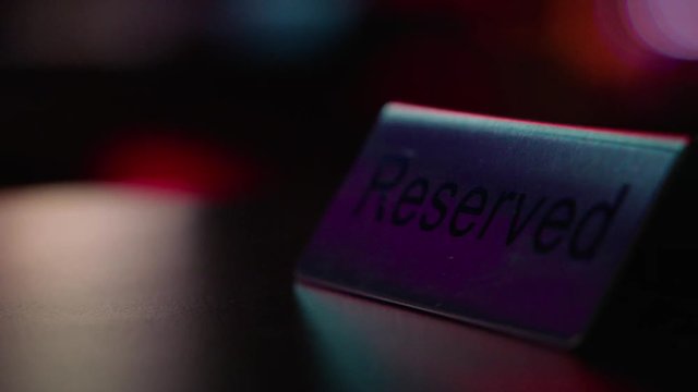 reserved table in nightclub with lights