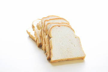 Homemade slide bread on the wooden table.