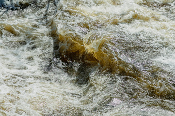 Blackstone River surface roiled into chaos