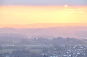sunset in mountains fiery sunset against the background of a provincial Italian town