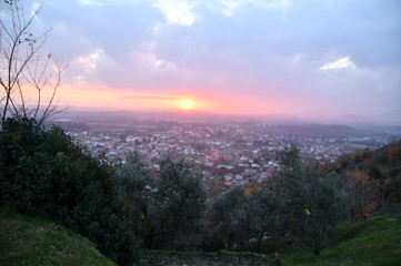 sunset over the city fiery sunset against the background of a provincial Italian town