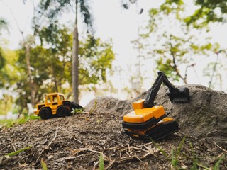 Excavation vehicle  toy on the ground in the garden