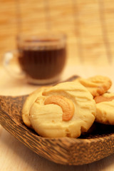 Chocolate chip butter cookie in wood bowl on wood table and space for write wording, delicious snack or dessert, cookie, cake, served with coffee or tea for special celebration or party