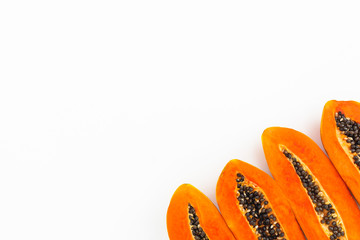 Slice of tasty papaya on white background. Flat lay. Top view. Fruit frame concept