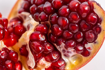 open pomegranate on a white background