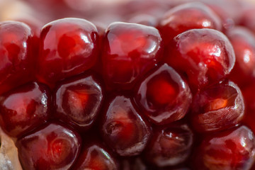 open pomegranate on a white background
