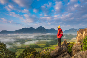 Young girl travels on high mountain in Vang-Vieng, Laos.