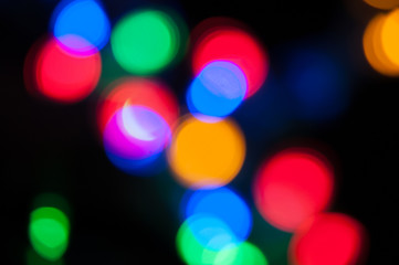 Blurred background, bright colored light bulbs, lights, the light from the garland.
