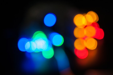 Blurred background, bright colored light bulbs, lights, the light from the garland.
