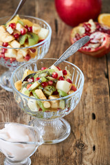 Salad with various fresh fruits in glass bowls