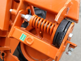 Image of an agricultural machine compression spring.