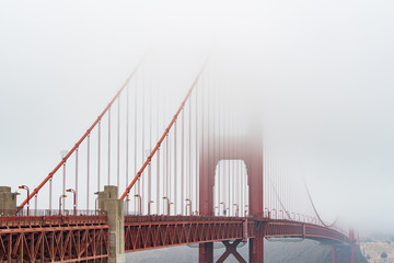 Golden Gate bridge covered in fog