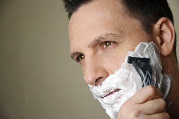 young man shaving