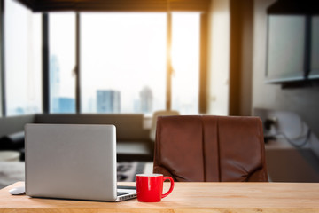 workspace with computer, laptop, office supplies, and coffee cup, smartphone, and tablet at office. desk work concept. in morning light