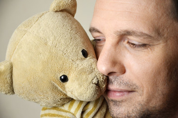 man with teddy bear