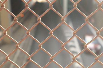 Close up Wired Fence and Blurred Background Car Traffic