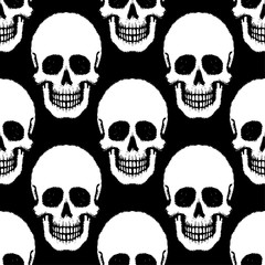 Seamless pattern with hand drawn skulls.