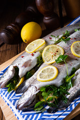 fresh trout with lemon and different herbs