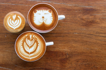 Coffee cup with latte art foam on wood table in coffee shop with copy space.Coffee is one of the most popular beverages.Improve Energy Levels and Burn Fat