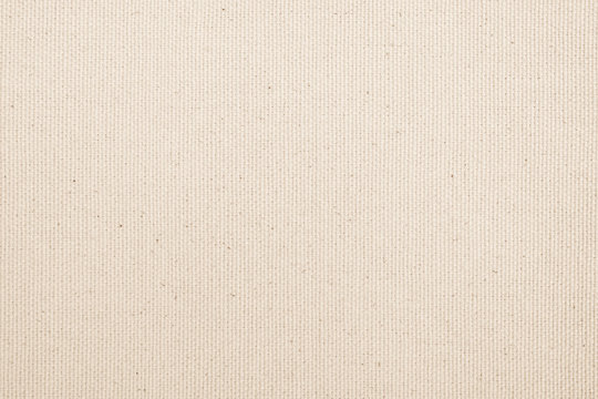 Muslin woven texture background light cream beige brown color