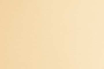Cotton silk blended fabric texture background in yellow gold brown color.
