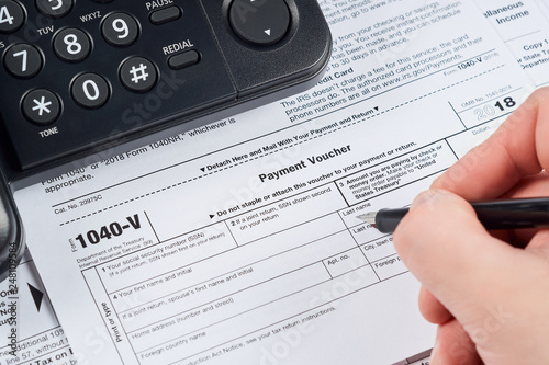 Tax Payment Form Human Fills Out The 1040 V Tax Form On Background