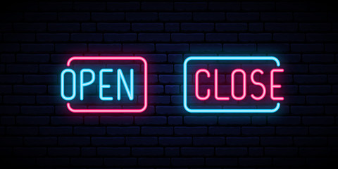 Obraz premium Open and Close neon iscription on brick wall background. Open Close Bright signboard. Vector design template.